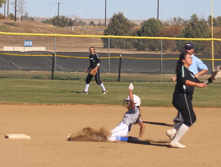 Rylee Balcazar of the Bluedevils slides into second base safely as Delta shortstop Juelz Sandoval awaits the throw during a class 3A regional playoff game in Limon Oct. 16.